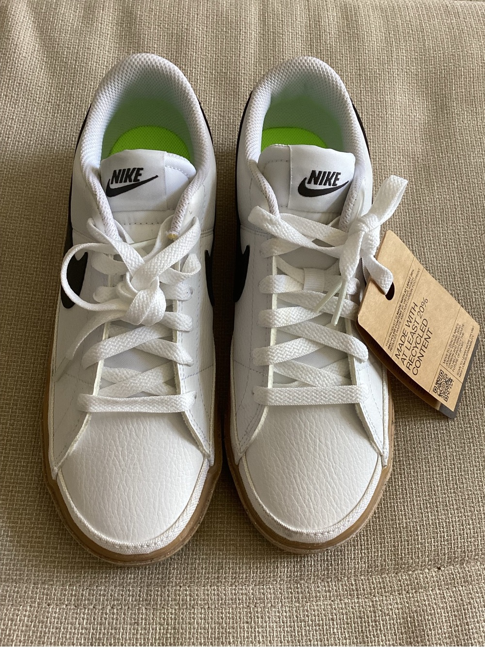 Nike Women's White Sneakers with Black Swoosh and Gum Sole